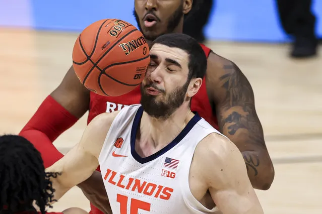 Illinois Fighting Illini forward Giorgi Bezhanishvili (15) reacts as the Spalding game ball hits his face in the game against the Rutgers Scarlet Knights in the first half at Lucas Oil Stadium in Indianapolis, Indiana, USA on March 12, 2021. (Photo by Aaron Doster/USA TODAY Sports)