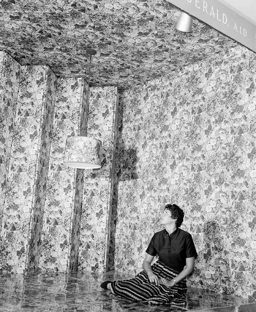 An allover pattern of bright flowered chintz is used in this suggestion for a garden supper room, designed by John Gerald, A.I.D., for the home furnishings show in New York, September 8, 1954. The chintz pattern is used for the ceiling walls, lampshade and floor, which is covered with several coats of clear plastic for protection. Gloria Hoffman adds a note of contrast. (Photo by Robert Kradin/AP Photo)