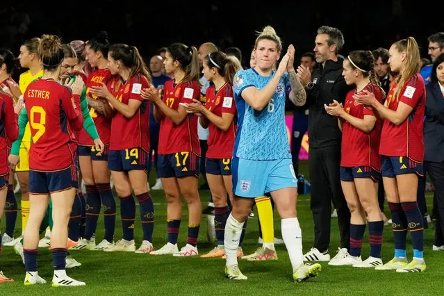 England's Millie Bright applauds while walking past Spain's players after the final of Women's World Cup soccer between Spain and England at Stadium Australia in Sydney, Australia, Sunday, August 20, 2023. (Photo by Rick Rycroft/AP Photo)