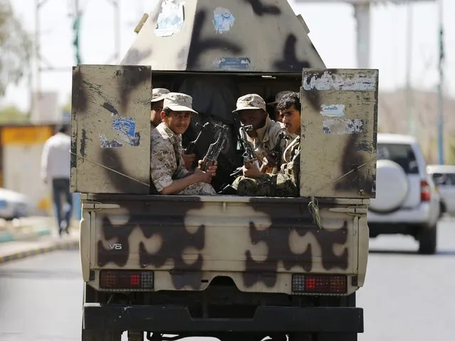 Houthi fighters ride a patrol vehicle outside a hotel hosting U.N.-sponsored negotiations on a political settlement for Yemen's crisis in Sanaa February 19, 2015. Yemen is slipping further into chaos as the Houthis, an Iranian-backed Shi'ite Muslim militia from the north, consolidate their grip on power after seizing the capital in September and sidelining the central government. (Photo by Khaled Abdullah/Reuters)