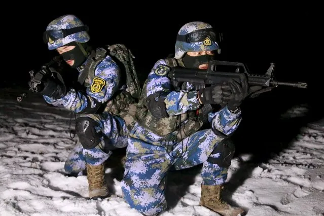 Soldiers of the People's Liberation Army (PLA) Marine Corps are seen in training at a military training base in Xinjiang Uighur Autonomous Region, January 11, 2016. Picture taken January 11, 2016. (Photo by Reuters/CNS Photo)