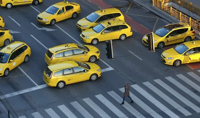 Taxis block a main road in Budapest's city centre, Hungary, January 18, 2016. Taxi drivers were protesting against the online taxi-hailing service Uber, demanding authorities to ban the service, according to local media. (Photo by Laszlo Balogh/Reuters)