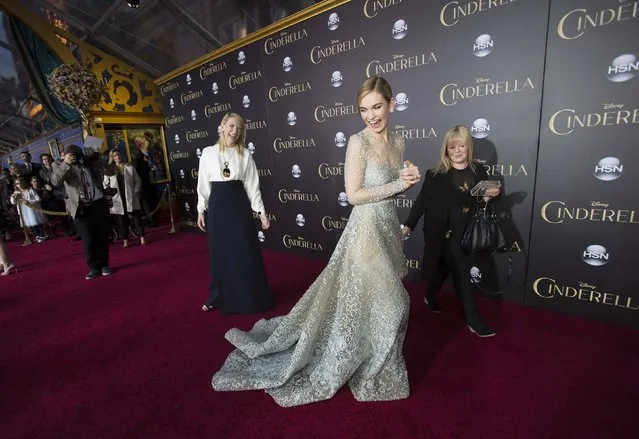 Cast members Cate Blanchett (3rd R) and Lily James (C) attend the premiere of "Cinderella" at El Capitan theatre in Hollywood, California March 1, 2015. The movie opens in the U.S. on March 13. REUTERS/Mario Anzuoni  (UNITED STATES - Tags: ENTERTAINMENT)