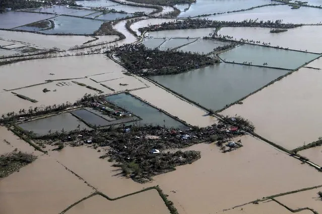 Rice fields are flooded after Typhoon Haiyan hit Iloilo Province in the central Philippines. (Photo by Leo Solinap/Reuters)