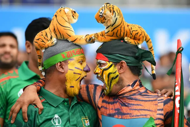 Spectators react in the crowd during the ICC Men's Cricket World Cup India 2023 between Pakistan and Bangladesh at Eden Gardens on October 31, 2023 in Kolkata, India. (Photo by Alex Davidson-ICC/ICC via Getty Images)