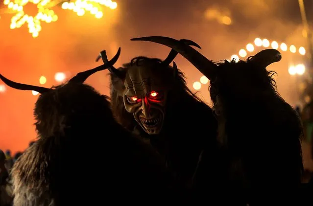 Participants dressed as the Krampus creature walk the streets in search of delinquent children during Krampus night in Neustift im Stubaital. (Photo by Sean Gallup)