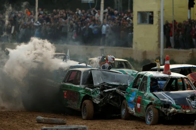 Drivers take part in a demolition derby organised by the Malta Motor Sports Association to raise funds for charity in Ta' Qali, outside Valletta, Malta, January 8, 2017. (Photo by Darrin Zammit Lupi/Reuters)