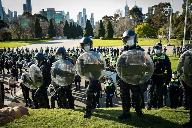Members of the Public Order Response Unit with Victoria Police is seen at the Shrine of Remembrance on September 22, 2021 in Melbourne, Australia. Protests started on Monday over new COVID-19 vaccine requirements for construction workers but turned into larger and at times violent demonstrations against lockdown restrictions in general. Melbourne is currently subject to COVID-19 lockdown restrictions, with people only permitted to leave home for essential reasons. (Photo by Darrian Traynor/Getty Images)