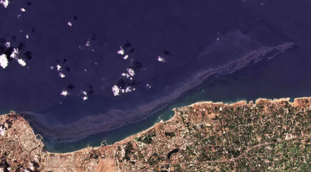 In this satellite photo from Planet Labs Inc., an oil spill is seen stretching off the coast near Baniyas, Syria, Tuesday, August 24, 2021. The massive oil spill caused by leakage from a power plant inside the Baniyas Thermal Station, one of Syria's oil refineries is spreading along the coast of the Mediterranean country, Syria's state news agency said and satellite photos showed Wednesday. (Photo by Planet Labs Inc. via AP Photo)