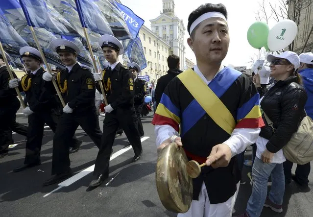 A man plays a traditional drum during a May Day rally in the Russian far-eastern city of Vladivostok May 1, 2015. (Photo by Yuri Maltsev/Reuters)