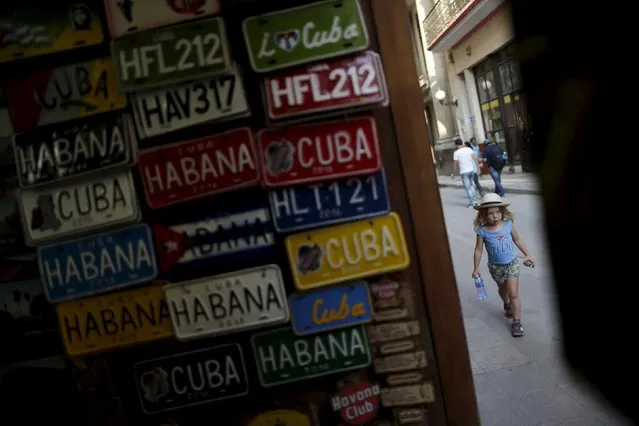 A young U.S. visitor walks on a street in Havana March 16, 2016. (Photo by Ueslei Marcelino/Reuters)