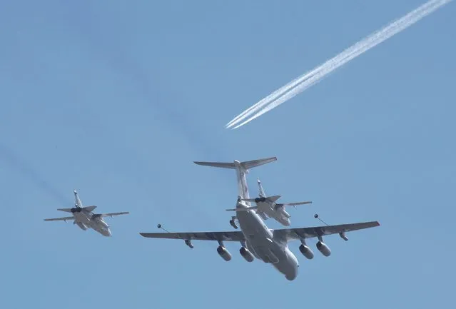 A Russian Il-78 air force tanker and Su-24 jets fly during a rehearsal for the Victory Day parade in central Moscow, Russia, May 7, 2015. (Photo by Grigory Dukor/Reuters)
