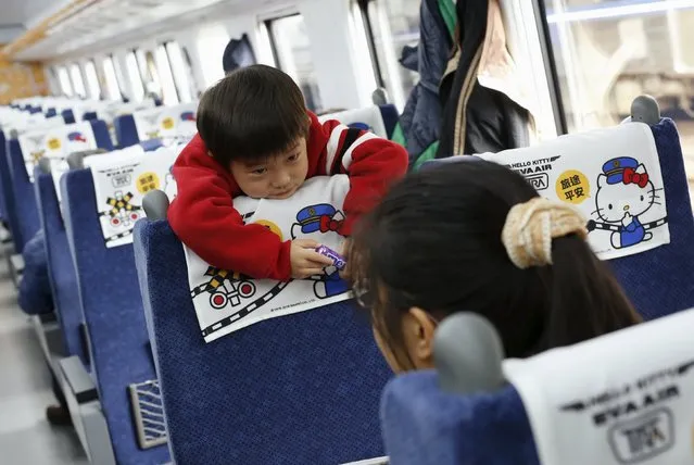 A child reacts inside a Hello Kitty-themed Taroko Express train in Taipei, Taiwan March 21, 2016. (Photo by Tyrone Siu/Reuters)