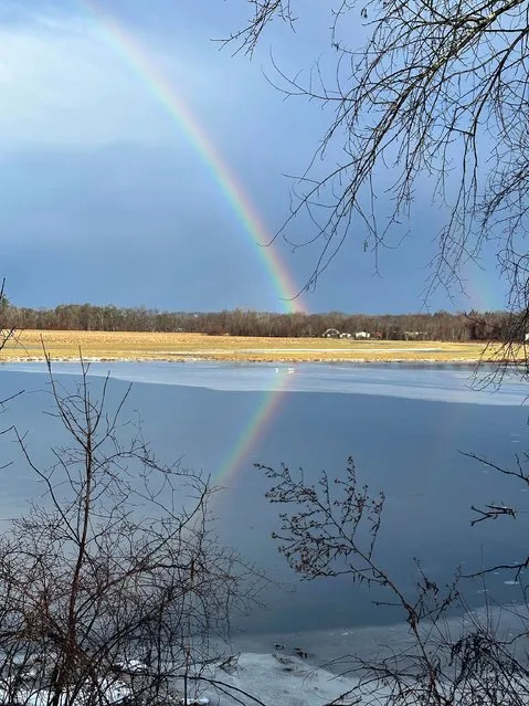 A rainbow appears in the sky over Concord, N.H. early Wednesday, January 10, 2024. (Photo by Holly Ramer/AP Photo)