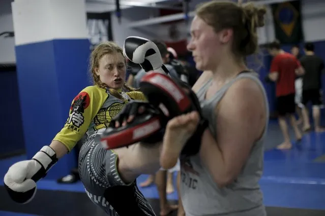 Sam Erenberger (L) trains with a partner at Ronin Athletics, a Mixed Martial Arts gym in midtown Manhattan in New York March 21, 2016. New York is poised to join the rest of the country in legalizing mixed martial arts (MMA) fights, as the state Assembly prepares to pass a bill to end a ban on the full-contact sport, a measure the Senate has approved on multiple occasions over the years. (Photo by Brendan McDermid/Reuters)