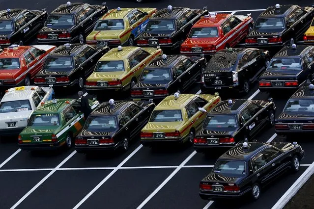Taxies park outside Tokyo station in Tokyo, Japan,  February 16, 2016. (Photo by Thomas Peter/Reuters)