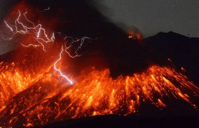 Volcanic lightning is seen at an eruption of Mount Sakurajima, in this photo taken from Tarumizu city, Kagoshima prefecture, southwestern Japan, in this photo taken by Kyodo February 5, 2016. A Japanese volcano about 50 km (30 miles) from a nuclear plant erupted on Friday, Japan's Meteorological Agency said, sending fountains of lava into the night sky. (Photo by Reuters/Kyodo News)