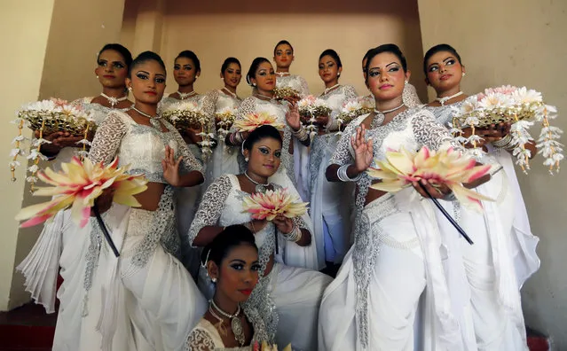 A group of female traditional dancers pose for photographs during International Women's Day celebrations in Colombo, Sri Lanka, March 8, 2017. (Photo by Dinuka Liyanawatte/Reuters)