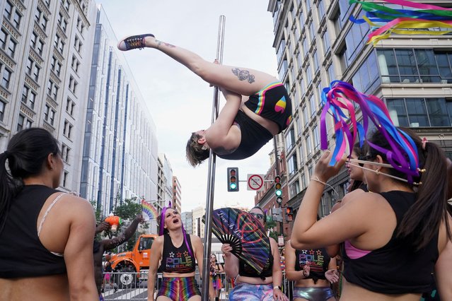 A pole dancer performs during the annual LGBTQ+ Capital Pride parade in Washington on June 8, 2024. (Photo by Nathan Howard/Reuters)
