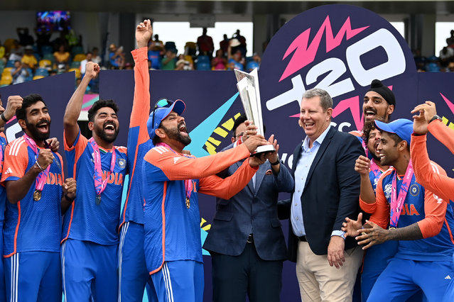 Rohit Sharma of India lifts the ICC Men's T20 Cricket World Cup Trophy following the ICC Men's T20 Cricket World Cup West Indies & USA 2024 Final match between South Africa and India at Kensington Oval on June 29, 2024 in Bridgetown, Barbados. (Photo by Gareth Copley/Getty Images)