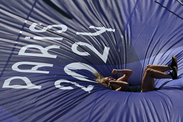 Britain's Molly Caudery reacts as she competes in the women's pole vault qualification of the athletics event at the Paris 2024 Olympic Games at Stade de France in Saint-Denis, north of Paris, on August 5, 2024. (Photo by Andrej Isakovic/AFP Photo)