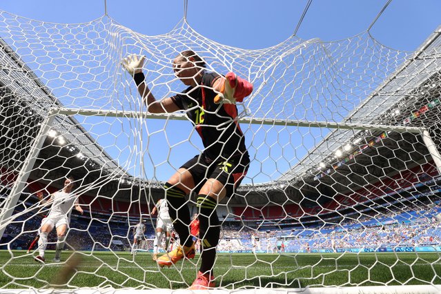 Ann-Katrin Berger gets tangled in the net during Germany’s women’s football bronze medal match against Spain at Lyon Stadium in Decines-Charpieu, France on August 09, 2024. (Photo by Albert Gea/Reuters)