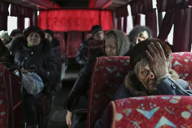 Local citizens sit in a bus as they wait to evacuation from Debaltseve of Donetsk area, Ukraine, 03 February 2015. The number of people who have been killed in the conflict in eastern Ukraine has climbed to 5,358, with the escalating violence claiming an average of 10 lives per day in the past few weeks, UN rights chief Zeid Ra'ad Al Hussein said 03 February 2015. (Photo by Anastasia Vlasova/EPA)