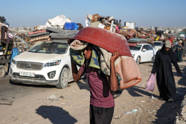 A Palestinian youth flees the Khan Younis area of the Gaza Strip, following Israeli military evacuation orders, saying its forces will soon operate there, Thursday, August 8, 2024. (Photo by Abdel Kareem Hana/AP Photo)