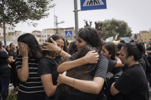 Mourners attend the funeral of Rami Marjiyeh, 15, and Naeem Marjiyeh, 29, two of the five Palestinian citizens of Israel, killed a day earlier when a gunman opened fire at a car wash in Yafa an-Naseriyye, near the city of Nazareth, Israel, Thursday, June 8, 2023. More than 100 people have been killed in violent crime in Arab communities since the start of this year, more than three times higher than at the same time last year. (Photo by Mahmoud Illean/AP Photo)