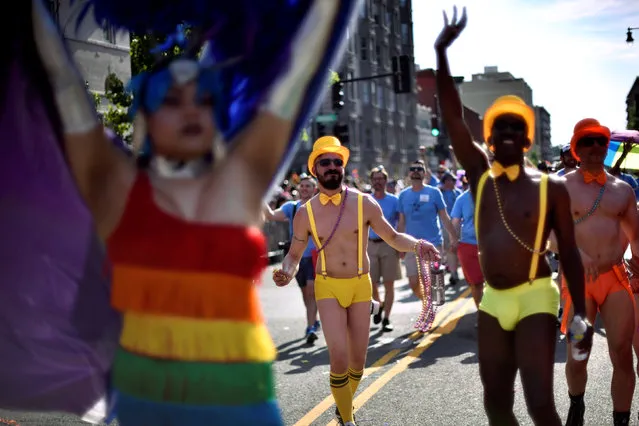 Participants march in the DC Capital Pride parade as it runs through Dupont Circle in Washington June 11, 2016. (Photo by James Lawler Duggan/Reuters)