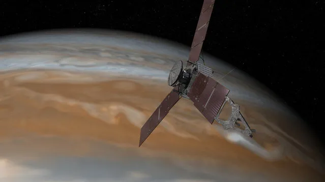 This artist's rendering made available by NASA/JPL-Caltech on July 7, 2015 shows the Juno spacecraft above Jupiter. The spacecraft is scheduled to arrive at the planet on July 4, 2016 to begin a nearly year-long study of the gas giant. (Photo by NASA/JPL-Caltech via AP Photo)