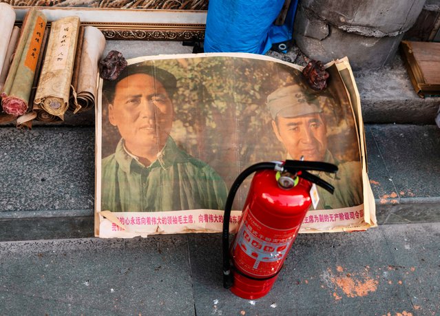 Old posters of Mao Zedong (L), former Chairman of the Chinese Communist Party, are sold on the street ahead of the celebrations of the 75th anniversary of the founding of the People's Republic of China, in Shanghai, China, 30 September 2024. On 01 October 2024, China will celebrate the 75th anniversary of the founding of the People's Republic. (Photo by Alex Plavevski/EPA/EFE)