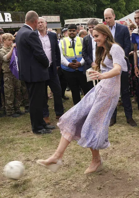 Britain's Kate, Duchess of Cambridge, plays soccer during a visit to Cambridgeshire County Day, Cambridge, England, Thursday, June 23, 2022. (Photo by Paul Edwards, Pool Photo via AP Photo)