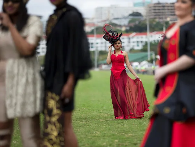 A person poses on the track during a fashion competition at the Durban July horse racing event in Durban, South Africa, July 2, 2016. (Photo by Rogan Ward/Reuters)