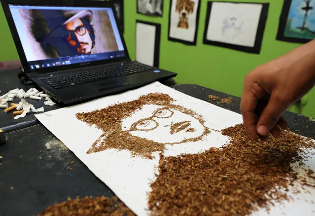 Artist Abdelrahman al-Habrouk creates a portrait of the actor Johnny Depp with tobacco in Alexandria, Egypt August 10, 2017. (Photo by Mohamed Abd El Ghany/Reuters)