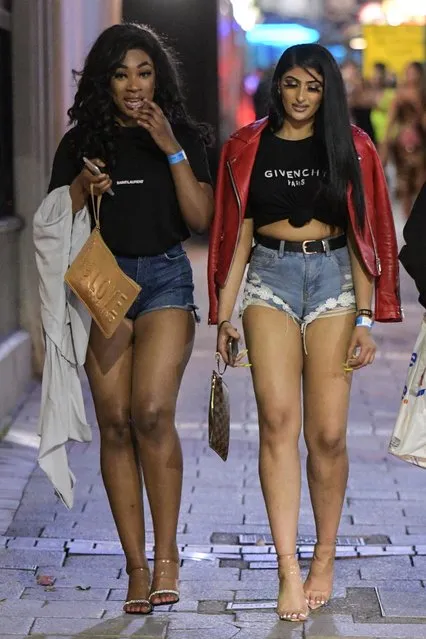 Girls in heels heading home in Birmingham, England on August 23, 2019. Bank Holiday boozers kicked off the long weekend with drink-fuelled evenings out all over the country last night. Pubs and bars across the UK were packed full of people looking to have a good time right into the early hours. (Photo by SnapperSK/SnapperMS/The Sun)
