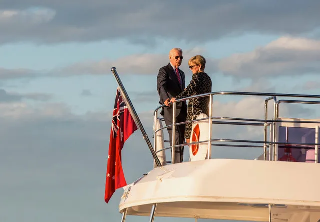 U.S. Vice President Joe Biden talks with Australian Foreign Affairs Minister Julie Bishop as they stand on a boat at sunset on Sydney Harbour, Australia, July 19, 2016. (Photo by Jessica Hromas/Reuters)
