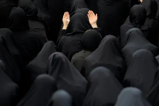 Iranian Shi'ite Muslim women take part in a mourning ritual ahead of Ashura, the holiest day on the Shi'ite Muslim calendar in Tehran, Iran on August 7, 2022. (Photo by Majid Asgaripour/WANA (West Asia News Agency) via Reuters)