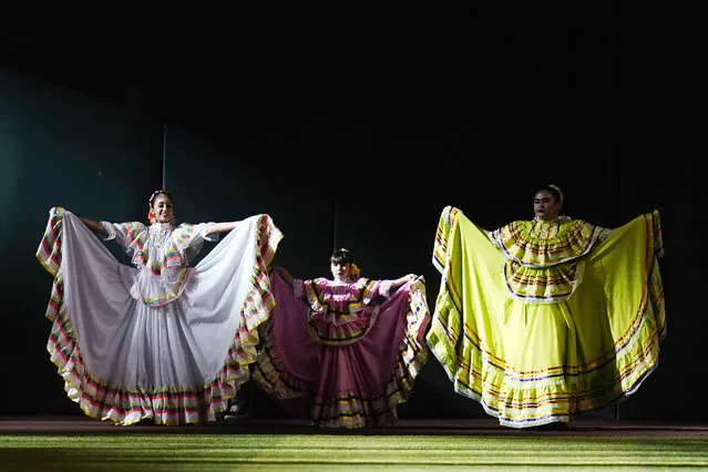 Local folklorico dancers perform during Hispanic Heritage Weekend at Chase Field prior to a baseball game between the Arizona Diamondbacks and the San Diego Padres in Phoenix, Saturday, September 17, 2022. (Photo by Ross D. Franklin/AP Photo)