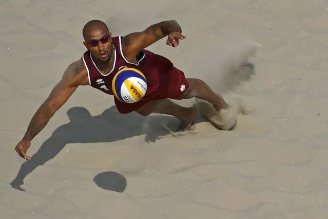 Qatar's Jefferson Santos Pereira plays a shot during the men's beach volleyball qualifying match between Spain and Qatar at the Beach Volley Arena in Rio de Janeiro on August 8, 2016, for the Rio 2016 Olympic Games. (Photo by Yasuyoshi Chiba/AFP Photo)