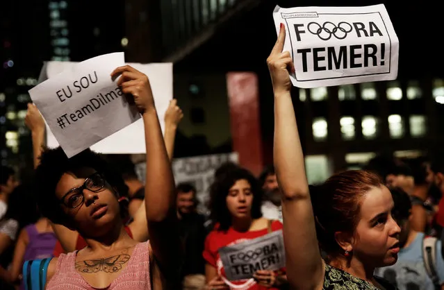 Supporters of Brazil's suspended President Dilma Rousseff, hold signs that reads “Out Temer” in reference to interim President Michel Temer, during a protest in Sao Paulo, Brazil, August 30, 2016. (Photo by Nacho Doce/Reuters)