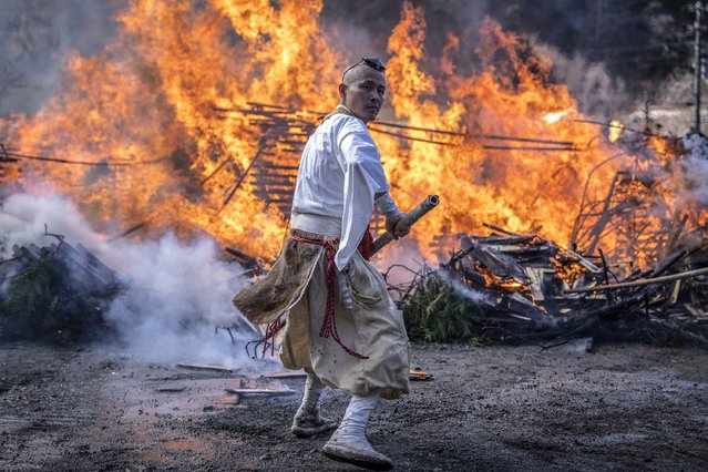 A Buddhist monk takes part in the “Hi-watari”, or fire walking festival at the Takaosan Yakuoin temple in Hachioji city, in the western suburbs of Tokyo, on March 9, 2025. (Photo by Yuichi Yamazaki/AFP Photo)