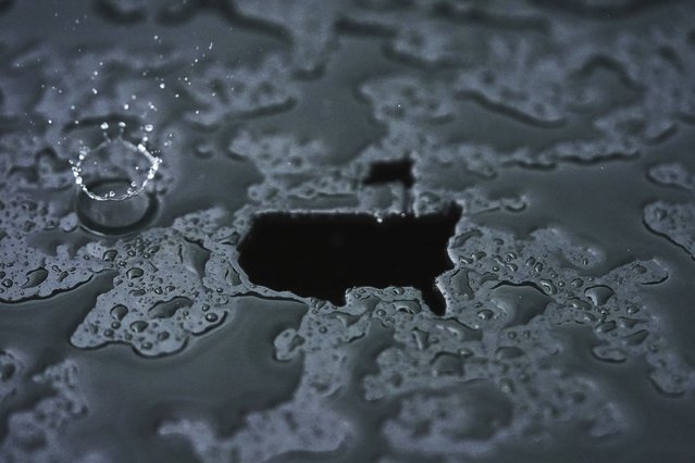 A raindrop splashes alongside a Masters Tournament logo at the Augusta National Golf Club in Georgia, April 7, 2025. (Photo by Matt Slocum/AP Photo)