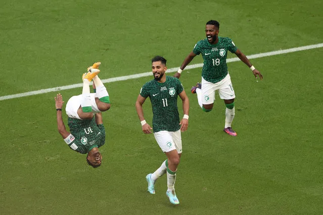 Salem Al-Dawsari of Saudi Arabia (L) celebrates with teammates after scoring their team's second goal during the FIFA World Cup Qatar 2022 Group C match between Argentina and Saudi Arabia at Lusail Stadium on November 22, 2022 in Lusail City, Qatar. (Photo by Julian Finney/Getty Images)