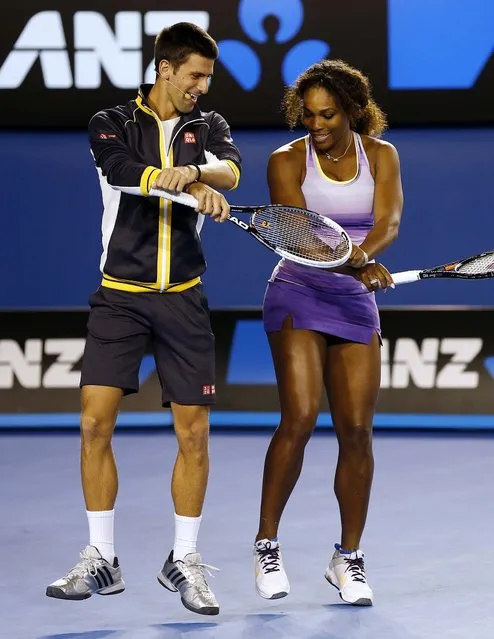 Novak Djokovic and Serena Williams perform the gangnam style dance during the Kids Tennis Day at Melbourne Park, January 11, 2013. (Photo by Andy Wong/Associated Press)