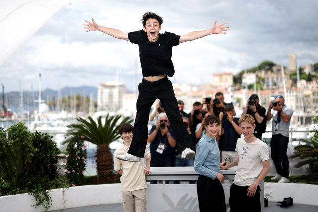 Cast member Come Peronnet jumps as he poses with cast members Solan Machado-Graner, Mathilde Riu and Valentin Campagne during a photocall for the film “Dossier 137” (Case 137) in competition at the 78th Cannes Film Festival in Cannes, France, on May 16, 2025. (Photo by Stephane Mahe/Reuters)