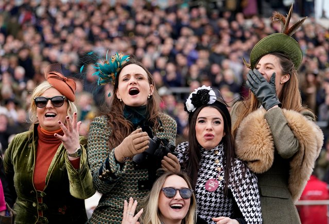 Racegoers react watching the BetMGM Queen Mother Champion Chase on day two of the 2025 Cheltenham Festival at Cheltenham Racecourse. Wednesday March 12, 2025. (Photo by Andrew Matthews /PA  Wirevia AP Photo)