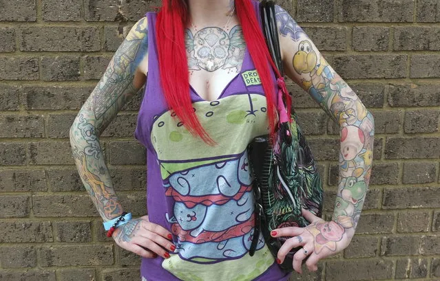 Sophie Lenton from Bracknell poses for a portrait in Brighton, southern England February 16, 2013. Brighton hosts “The Brighton Tattoo Convention” this weekend, an annual two-day gathering which attracts visitors, performers and tattoo artists from around the world. Photograph taken February 16, 2013. (Photo by Toby Melville/Reuters)