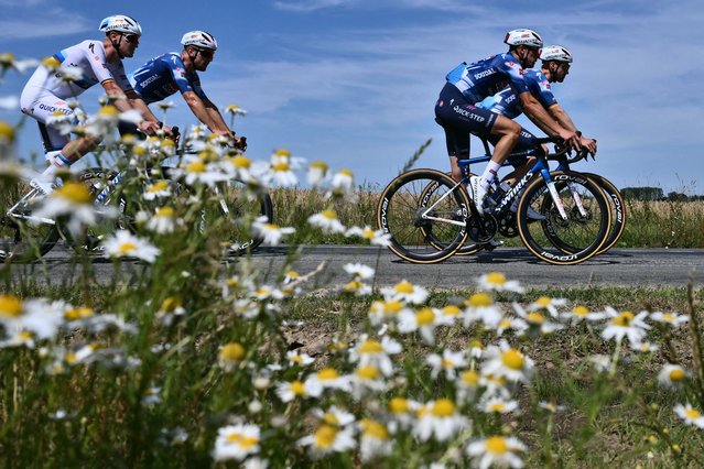 Soudal Quick-Step team riders cycle in a training session on the eve of the start of the 112th edition of the Tour de France cycling race, in Lille, northern France, on July 4, 2025. (Photo by Marco Bertorello/AFP Photo)