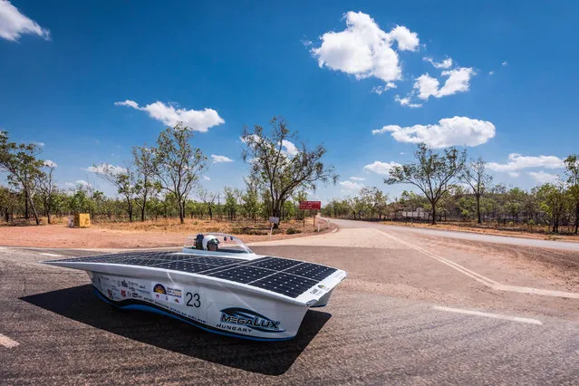 The GAMF Hungary car from Hungary competes during the first day of the 2015 World Solar Challenge near Katherine, Australia, on Sunday, October 18, 2015. 45 Solar cars from 25 different countries participate in a 3,000 km race from Darwin to Adelaide. (Photo by Geert Vanden Wijngaert/AP Photo)